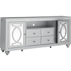 a white entertainment center with drawers and marble top