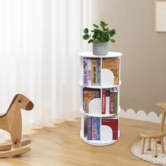 a wooden rocking horse next to a bookshelf with several books on it and a potted plant in the corner