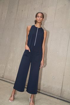 Cropped sleeveless jumpsuit with exposed center front zipper and patch pockets in technical stretch fabric. Final Sale Info & Care Dry Clean Only 95% Polyester, 5% Elastane Made in the U.S.A. SKU: NS17D128 Size & Fit Model is 5'9" and wearing size 4 Zip Front Dress, Lace Pants, Gathered Dress, Cowl Neck Dress, Cropped Jumpsuit, Racerback Dress, Vogue Russia, Burgundy Sweater, Spring Summer 2017