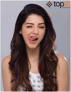 an image of a woman making a funny face with her mouth wide open and tongue out