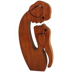 two wooden animals that are standing next to each other on a white background, one is holding the other's head