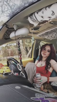 a woman sitting in the back seat of a car