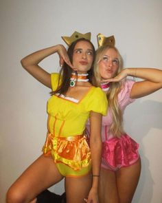 two women in costumes posing for the camera