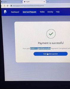 a computer screen showing the payment is successful button