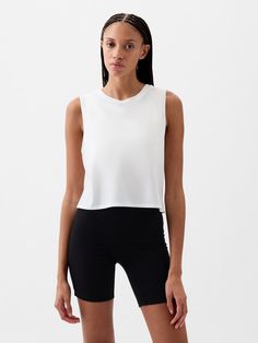 Soft, breathable cropped muscle T-shirt.  Crewneck.  Sleeveless.  * Fit: Relaxed.  A straight & easy fit.  * Style Note: For a more Classic fit, go down one Muscle T Shirts, Gap Fit, White Crew Neck, Gap, Workout Clothes, Casual Chic, Colorful Shirts, Active Wear, Crew Neck