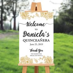 an easel with a sign that says welcome to danielle's quinceauera