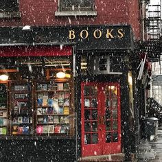 a book store on a city street in the snow