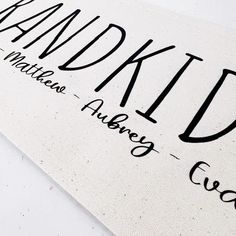 a white sign with black lettering on it that says handmade written in cursive writing