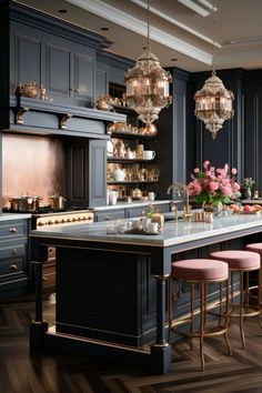 an elegant kitchen with blue cabinets and pink stools in front of the countertop