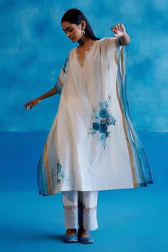 Ivory and blue silk chanderi kaftan featuring floral hand-paint and zari embroidery details on the neckline and hem. Paired with a matching embroidered silk chanderi pant and slip. - Aza Fashions Bohemian Chanderi Kurta With Embroidered Neckline, Designer Embroidered Neckline Kurta For Summer, Silk Set With Embroidered Neckline And Straight Kurta, Spring Silk Anarkali Kaftan, Eid Chanderi Kaftan With Floral Embroidery, Eid Floral Embroidered Chanderi Kaftan, Eid Designer Wear Dupatta With Embroidered Neckline, Eid Designer Wear Palazzo Set With Embroidered Neckline, Designer Embroidered Neckline Palazzo Set For Eid