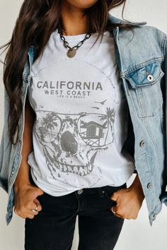 This cute graphic tee features a relaxed fit, edgy skull graphic print, and is made of soft comfy cotton. Crew neckline Short sleeves California skull graphic print Relaxed fit 100% Cotton Fit and sizing:  Measurements are approximate. Length measurements are taken from the top of the shoulder to the bottom hem laying Life Is A Beach, Beach Tee, Skull Graphic, Cute Graphic Tees, Trendy Graphic Tees, Casual Fall Outfits, Casual Fall, Beach Life, Spring Outfits