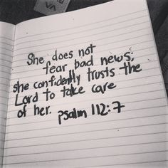 a notepad with the words she does not fear bad news, she confidently trusts the lord to take care of her