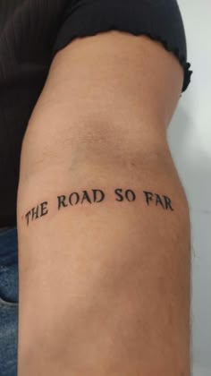 the road so far tattoo on someone's leg that says, the road so far