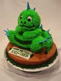 there is a green cake that looks like a creature