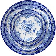 four blue and white plates stacked on top of each other in the shape of a circle