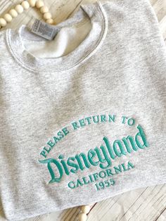 Please Return To Dland/ DWorld Embroidered Crewneck Sweatshirt - Ash California Clothes, Disney Trip Outfits, Custom Embroidered Sweatshirt, Cute Disney Outfits, California Outfits, Disney Sketches, Trip Outfits, Disney Shop, Disney California