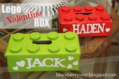 two lego valentine boxes sitting on top of a glass table with the words jack written in white