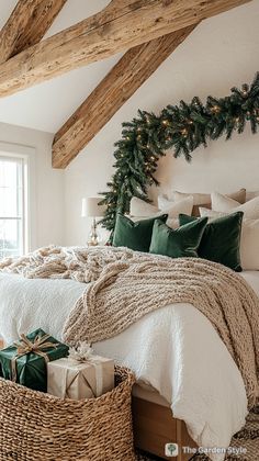 a bedroom decorated for christmas with presents under the bed and wreath on the headboard