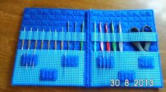 a blue case filled with lots of knitting needles