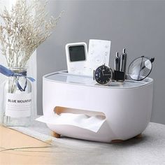 there is a white table with some items on it