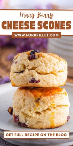 two biscuits stacked on top of each other with the words, may berry cheese scones