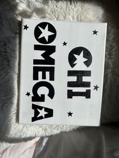 a white sign with black letters and stars on it that says, omegga