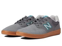 New Balance Numeric 425 - Skate Shoes : Grey/Gum : Move with ease from the boardwalk to the bar in the New Balance Numeri 425 sneakers! Coastal-inspired court shoes taking cues from the 520 and 620 styles. Uppers of durable faux-suede and breathable mesh. Lace-up closure. Padded insole for all-day comfort. Non-marking rubber outsole offers long-lasting wear. Imported. Measurements: Weight: 13 oz Product measurements were taken using size US Men's 12, Women's 13.5, width Medium. Please note that Casual Slip-resistant Skate Shoes With Round Toe, Casual Sneakers For Skateboarding With Padded Tongue, Casual Skateboarding Sneakers With Padded Tongue, Casual Slip-resistant Skate Shoes For Streetwear, Casual High-top Skate Shoes With Padded Tongue, Casual Slip-resistant Skate Shoes For Sports, Casual Mid-top Sneakers With Padded Tongue, Casual Lace-up Sneakers With Padded Tongue, Slip-resistant Round Toe Skate Shoes For Sports