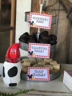 a table topped with lots of cupcakes and cookies