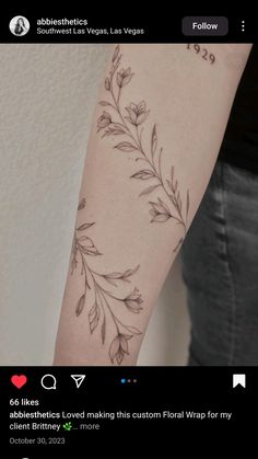 a woman's arm with flowers on it and the words love written in black ink