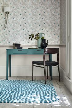 a blue table and chair in a room