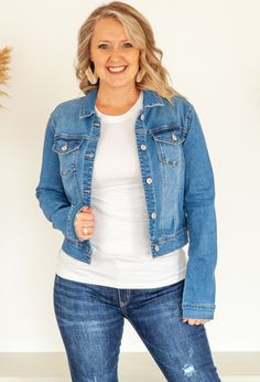 The one versatile item your closet needs is a great stone washed denim jacket to pair with all your favorite outfits for daytime and evening outings. Cropped style eatures two pockets and button front closure. Pairs perfectly with the Dreamer Tee or Essential Tee in any color. Shown with Kan Can Distressed Jeans and Kan Can Jeans or Linen Pants. 68% Cotton 26% Polyester 4% Rayon 2% Spandex 0-4 Small 5-9 Medium 10-12 Large Stretch Outerwear With Pockets For Everyday, Everyday Light Wash Denim Jacket With Buttoned Pockets, Chic Dark Wash Denim Jacket For Day Out, Medium Wash Button-up Denim Jacket For Day Out, Chic Washed Button-up Denim Jacket, Stretch Cotton Outerwear In Medium Wash, Spring Single-breasted Denim Jacket, Fitted Denim Jacket In Medium Wash, Chic Dark Wash Denim Jacket With Pockets