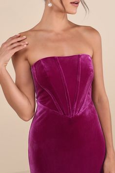 You'll command the room with an impressive look like the Lulus Regal Affect Magenta Velvet Bustier Strapless Maxi Dress! Luxe, stretchy velour velvet shapes this sensational dress with a flattering straight neckline (with hidden no-slip strips) and a strapless, bustier-style bodice with supportive boning. Basque waist sits atop a figure-skimming column skirt that falls to an elegant maxi hem with a kick pleat at the back for movement. Hidden back zipper/clasp. Fit: This garment fits true to size Glamorous Velvet Strapless Dress, Glamorous Strapless Velvet Dress, Fitted Strapless Velvet Dress, Fitted Velvet Strapless Dress, Velvet Party Corset, Strapless Velvet Cocktail Dress, Elegant Fitted Strapless Velvet Dress, Fitted Strapless Velvet Cocktail Dress, Strapless Velvet Dress For Prom