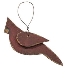 a wooden bird ornament hanging from a string