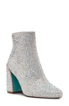 Rhinestone embellishments shimmer and shine against the satin upper of a glamorous bootie set on a cushioned footbed and chunky block heel. 3 1/2" heel 4 1/4" shaft Side zip closure Cushioned footbed Textile and synthetic upper/synthetic lining and sole Imported Sparkling High Heel Evening Boots, Glamorous Embellished Boots For Formal Occasions, Chic Embellished Boots With Block Heel, Evening High Heel Boots With Rhinestones, Glamorous Round Toe Bedazzled Heels, Glamorous Bedazzled Heels With Round Toe, Glamorous Bedazzled Round Toe Heels, Elegant Embellished Block Heel Boots, Glamorous Embellished Evening Boots