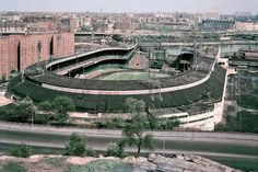 an aerial view of a tennis court in the city