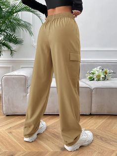 Experience comfort and style with our High Waist Side Pocket Flap Cargo Pants. Crafted from polyester fabric, these cargo pants feature a high waistline for a flattering fit. The elastic waist closure ensures a comfortable and secure fit. With multiple pockets, you can conveniently carry your essentials. The non-stretch fabric provides durability, and the regular fit offers freedom of movement. Specifications: Type: Cargo Pants Closure Type: Elastic Waist Details: Pocket Waist Line: High Waist L Workwear Cargo Pants With Elastic Waistband, Solid Color Ankle-length Cargo Pants With Elastic Waistband, Stretch High-waisted Cargo Pants With Elastic Waistband, Utility High-waisted Pants With Elastic Waistband, High Waist Stretch Cargo Pants With Elastic Waistband, Cargo Pants With Elastic Waistband, Versatile High-waisted Sweatpants With Pockets, Versatile Ankle-length Cargo Pants With Side Pockets, Ankle-length Cargo Pants With Elastic Waistband