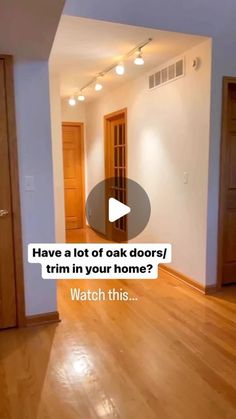 an empty living room with wood floors and white walls, has a caption that reads have a lot of oak doors trim in your home? watch this