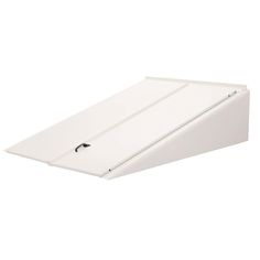 a white surfboard sitting on top of a white wall