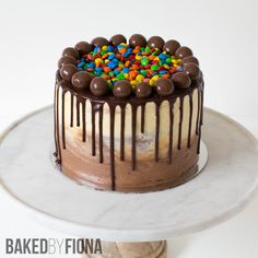 a cake with chocolate frosting and sprinkles on top