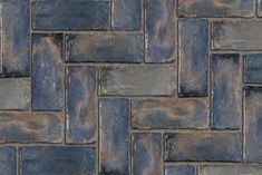 a close up view of a brick wall made out of blue slate tiles, with no mortars or mortars on it