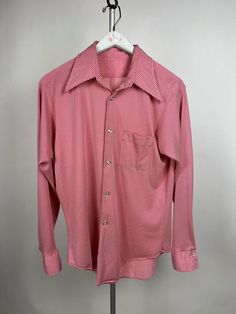 "A Vintage Find! This 1970's Button down is great condition.  THERE IS NO TAG on this garment- I think it is 70s vintage because it is made of polyester and the collar is very pointed. The shirt is size Large.  Length 23 1/2\" Chest 42\" Shoulder to Shoulder 17\"  Sleeve Length 23\" I did sew missing buttons, they match perfectly with original ones on the shirt. I added buttons to cuffs and front button down. This shirt is in GOOD condition for its age. There is some Fabric wear and a little hole in the back. All items in my shop, Simprov, sewing improvisations were curated by myself, Carrie.  I have been producing high school theatre for over 20 years.  I blend my profession with my love being a mom.  You can will enjoy my expertise and quality in your garment.  All Items have been repair Vintage Red Button-up Shirt, Red Vintage Shirt With Vintage Print, Retro Collared Shirt With Vintage Print, Red Vintage Print Shirt, Vintage Pink Button-up Shirt, Vintage Pink Shirt With Buttons, Vintage Pink Buttoned Shirt, Retro Long Sleeve Shirt With Retro Print, Retro Button-up Tops With Vintage Pattern