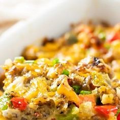 a casserole dish with meat, vegetables and cheese on it is ready to be eaten