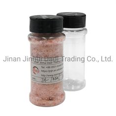 two jars filled with pink sand next to each other