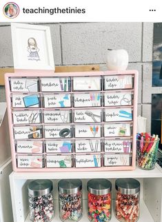 a shelf filled with lots of different types of crafting supplies on top of it