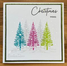 a handmade christmas card with trees on it