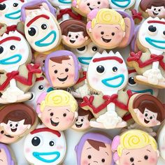 there are many decorated cookies in the shape of cartoon characters on display for everyone to enjoy