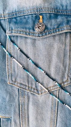 the back pocket of a pair of blue jeans