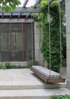 an outdoor patio with stone steps and seating area