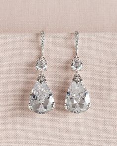 the bride's earrings are adorned with swarong crystals and cubicnestones