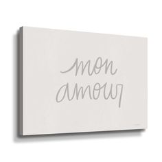 a white wall mounted canvas with the words mom amoup in cursive writing